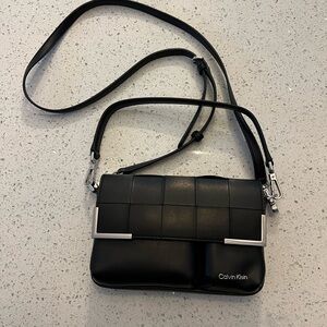 Calvin Klein convertible small crossbody bag, with silver colored metal accents